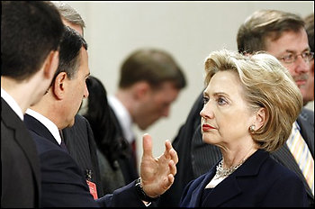 Italy's Foreign Minister Franco Frattini, left center, shares a word with U.S. Secretary of State Hillary Rodham Clinton, second right, during a meeting of NATO foreign ministers at NATO headquarters in Brussels, Thursday March 5, 2009. Relations with Russia and Afghanistan will be the key items on the agenda. (AP Photo/Francois Lenoir, Pool) (Francois Lenoir - AP)