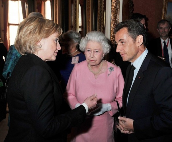US Secretary of State Hillary Clinton (L) is pictured with Britain's Queen Elizabeth II (C) and French President Nicolas Sarkozy (R) during a reception for world leaders attending the G20 summit at Buckingham Palace, in London, on April 1, 2009. World leaders wrangled Wednesday on how a London summit could fix the global economy as demonstrators attacked a bank in an anti-capitalist riot in the British capital. Demonstrators laid siege to the Bank of England and smashed the windows of a nearby bank that has become a symbol of the financial crisis rescue carried out by the British government which will be discussed at Thursday's Group of 20 summit in the city. AFP PHOTO/John Stillwell/WPA POOL (Photo credit should read JOHN STILLWELL/AFP/Getty Images)